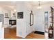 Bright entryway featuring hardwood floors, a fireplace, and ample natural light at 8198 S Sicily Ct, Aurora, CO 80016