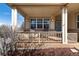 Close-up of a welcoming front porch with chairs, offering a relaxing outdoor space at 8198 S Sicily Ct, Aurora, CO 80016