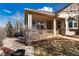 Inviting front porch with charming railings and cozy seating, perfect for relaxing outdoors at 8198 S Sicily Ct, Aurora, CO 80016