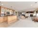 Large living room featuring a wet bar and fireplace, providing the perfect spot to relax and unwind at 8198 S Sicily Ct, Aurora, CO 80016