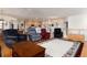 Open-concept living space featuring hardwood floors and seamless flow to the kitchen at 8198 S Sicily Ct, Aurora, CO 80016