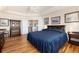 The main bedroom features hardwood floors, plenty of space, and lovely decor at 8198 S Sicily Ct, Aurora, CO 80016