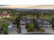 Expansive aerial view of a home nestled amongst lush greenery and rolling hills, with mountain views at 7071 Turweston Ln, Castle Pines, CO 80108