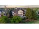 Spacious backyard featuring a deck and patio, ideal for outdoor entertaining and relaxation at 7071 Turweston Ln, Castle Pines, CO 80108