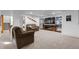 Finished basement with plush carpeting, a large TV, display cases, and comfortable seating at 7071 Turweston Ln, Castle Pines, CO 80108