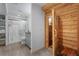Elegant bathroom featuring a glass-enclosed shower and a sauna with a natural wood finish at 7071 Turweston Ln, Castle Pines, CO 80108