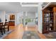 Inviting living space with open layout, a modern fireplace, and hardwood floors at 7071 Turweston Ln, Castle Pines, CO 80108