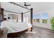 Bright main bedroom with natural light, hardwood floors, and vaulted ceilings at 7071 Turweston Ln, Castle Pines, CO 80108