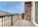 Wood-floored balcony with wrought iron railings offers community views at 14902 E Poundstone Dr, Aurora, CO 80015