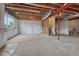 Unfinished basement with exposed ceiling and large windows at 14902 E Poundstone Dr, Aurora, CO 80015