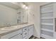 Bathroom with double sinks, vanity, and modern lighting at 14902 E Poundstone Dr, Aurora, CO 80015