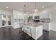 Well-lit kitchen with granite countertops, stainless appliances, and ample cabinet space at 14902 E Poundstone Dr, Aurora, CO 80015