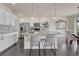 Elegant kitchen with island, granite countertops, and modern appliances at 14902 E Poundstone Dr, Aurora, CO 80015