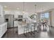 Modern kitchen with stainless steel appliances and a large island at 14902 E Poundstone Dr, Aurora, CO 80015