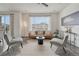 Cozy living room with stylish furniture and plenty of natural light at 14902 E Poundstone Dr, Aurora, CO 80015