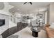 Open floor plan connecting living room to modern kitchen at 14902 E Poundstone Dr, Aurora, CO 80015