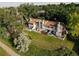 Aerial view of the property, revealing its spacious yard and tree-lined surroundings at 12183 W Chenango Dr, Morrison, CO 80465