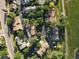 Aerial view of a residential neighborhood with mature trees and well-maintained homes in a peaceful setting at 12183 W Chenango Dr, Morrison, CO 80465