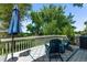 Back deck featuring a patio dining set under a market umbrella with lovely backyard views at 12183 W Chenango Dr, Morrison, CO 80465
