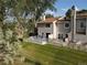 Backyard view showcasing the private deck and well-maintained lawn at 12183 W Chenango Dr, Morrison, CO 80465