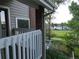 Inviting balcony view of neighborhood from a charming exterior of brick and siding home in a residential area at 12183 W Chenango Dr, Morrison, CO 80465