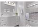 Updated full bathroom with granite counters, marble floors, shower and tub combo, and updated sink and fixtures at 12183 W Chenango Dr, Morrison, CO 80465