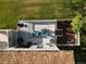 Aerial view of a well-kept deck and patio area with chairs and outdoor features, perfect for relaxing and entertaining at 12183 W Chenango Dr, Morrison, CO 80465