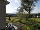 Outdoor deck area with patio furniture offering picturesque views of the surrounding landscape at 12183 W Chenango Dr, Morrison, CO 80465