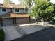 Two-story home with a two-car garage and well-maintained landscaping at 12183 W Chenango Dr, Morrison, CO 80465