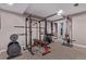 Home gym featuring weights, squat rack, and additional ski storage at 12183 W Chenango Dr, Morrison, CO 80465