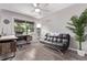 Bright office space featuring sleek desk, sofa and stylish decor, creating a comfortable work environment at 12183 W Chenango Dr, Morrison, CO 80465
