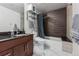 Modern bathroom with dark tile, marble flooring, and a bathtub at 891 14Th St # 2816, Denver, CO 80202