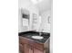 Chic bathroom featuring dark wood vanity with granite countertop, modern fixtures, and ample lighting at 891 14Th St # 2816, Denver, CO 80202