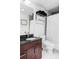 Stylish bathroom with dark wood cabinets, granite countertop, modern fixtures, and elegant design at 891 14Th St # 2816, Denver, CO 80202