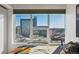 Bedroom with large windows showcasing stunning city views at 891 14Th St # 2816, Denver, CO 80202