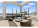 Cozy rooftop fire pit lounge with seating at 891 14Th St # 2816, Denver, CO 80202