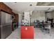 Modern kitchen with stainless steel appliances and red island at 891 14Th St # 2816, Denver, CO 80202