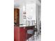 Close-up of kitchen island with bar stools and pendant lighting, offering a contemporary design with stylish accents at 891 14Th St # 2816, Denver, CO 80202