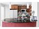 Modern kitchen with stainless steel appliances, a functional island, and stylish pendant lighting for a sleek look at 891 14Th St # 2816, Denver, CO 80202