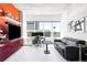 Modern living room with city views, a dedicated workspace, and stylish decor including a flat screen TV at 891 14Th St # 2816, Denver, CO 80202