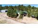 Aerial view of the property surrounded by lush green trees at 1059 S Elbert St, Elizabeth, CO 80107