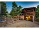 Charming walkout basement with covered deck and stone terraced yard with well maintained landscaping at 1059 S Elbert St, Elizabeth, CO 80107