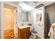 Functional bathroom with a vanity, mirrored cabinet, and shower with curtain at 1059 S Elbert St, Elizabeth, CO 80107