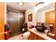 Stylish bathroom with a vessel sink, stone accents, and a glass-enclosed shower at 1059 S Elbert St, Elizabeth, CO 80107