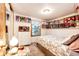 Light-filled bedroom showcasing charming decor, comfortable bed and ample storage at 1059 S Elbert St, Elizabeth, CO 80107