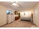 Spacious bedroom with neutral walls, ceiling fan, dresser, television, and a comfortable bed at 1059 S Elbert St, Elizabeth, CO 80107