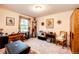 Cozy bedroom space with natural light and views of the outdoors through the window at 1059 S Elbert St, Elizabeth, CO 80107