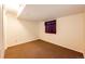 Simple bedroom with neutral walls, carpeted floor, and a window covered by a curtain at 1059 S Elbert St, Elizabeth, CO 80107