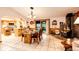 Cozy dining room featuring a fireplace, glass table, and seamless access to the kitchen at 1059 S Elbert St, Elizabeth, CO 80107
