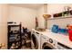 Laundry room featuring modern appliances and ample storage space on shelves at 1059 S Elbert St, Elizabeth, CO 80107